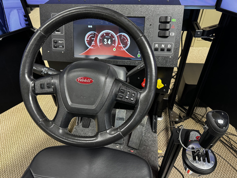 The close up of a wheel of a heavy truck miniSim cab