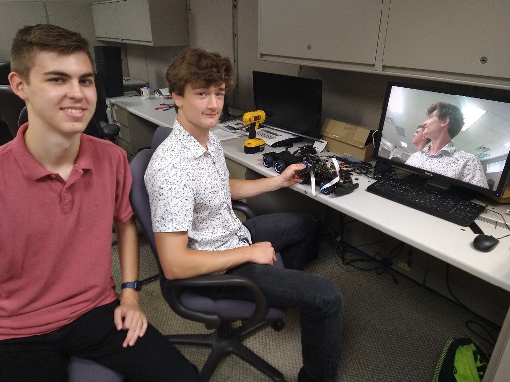 Students Tommy Rogers and Marcus Miller worked on the robotics platform this past summer, along with and Kyle Chi (not pictured)