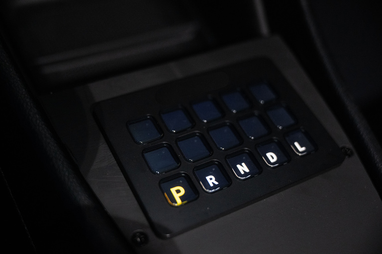 A gear shift showing that the vehicle is in park.