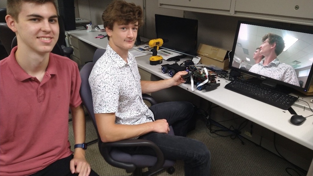 Students Tommy Rogers and Marcus Miller worked on the robotics platform this past summer, along with and Kyle Chi (not pictured)